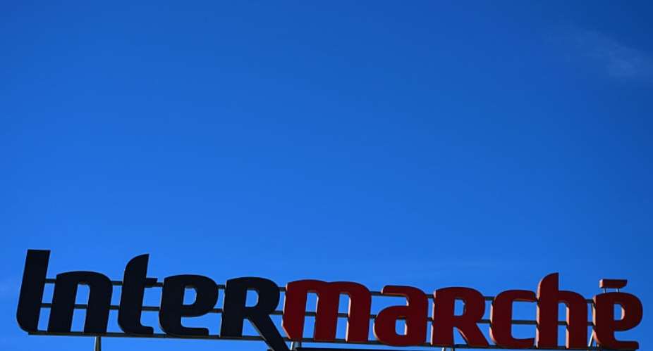 This photograph taken in Agde on October 9, 2026 shows the logo of French supermarket Intermarch, part of the group Les Mousquetaires, on the facade of a store. -  Gabriel Bouys, AFP