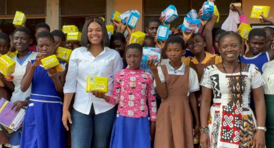 Hitz FM's Doreen Avio spends time with girls of Luom Presby Basic School