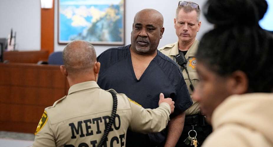 Duane Davis is escorted by police from a sentencing hearing after his murder conviction on October 13, 2026. -  John Locher, Reuters