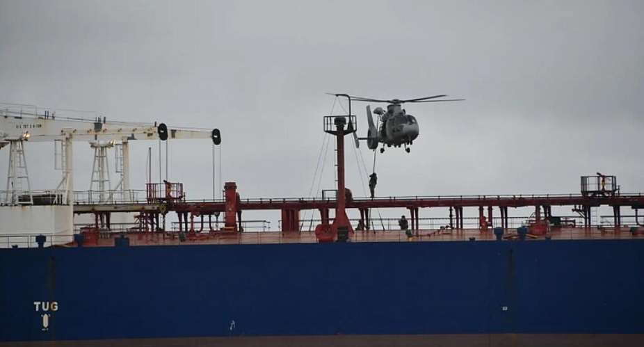 French soldiers abseil from a helicopter onto the oil tanker DF Peak during an operation to intercept it in the Indian Ocean, near Runion, on 12 October 2026. -  tat-major des Armes / France