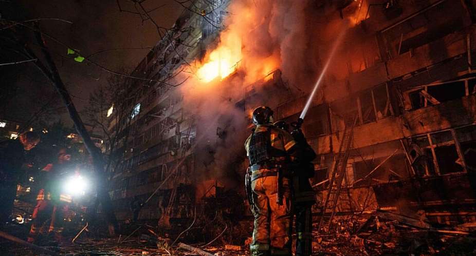 Rescue workers put out a fire of a multi-story residential building damaged in a Russian missile strike on Kyiv, Ukraine, on October 13, 2026. -  Evgeniy Maloletka, AP