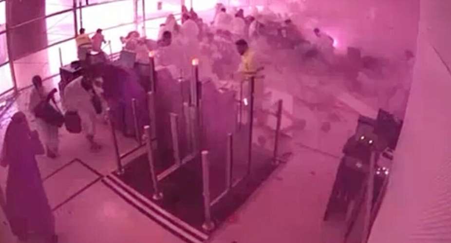 This image from CCTV video released by Saudi Arabias Media Ministry shows passengers taking cover as flames and smoke fill part of King Khalid International Airport in Riyadh, Saudi Arabia, during what authorities described as a strike at the airport on Saturday, 10 October 2026. - Saudi Media Ministry via AP