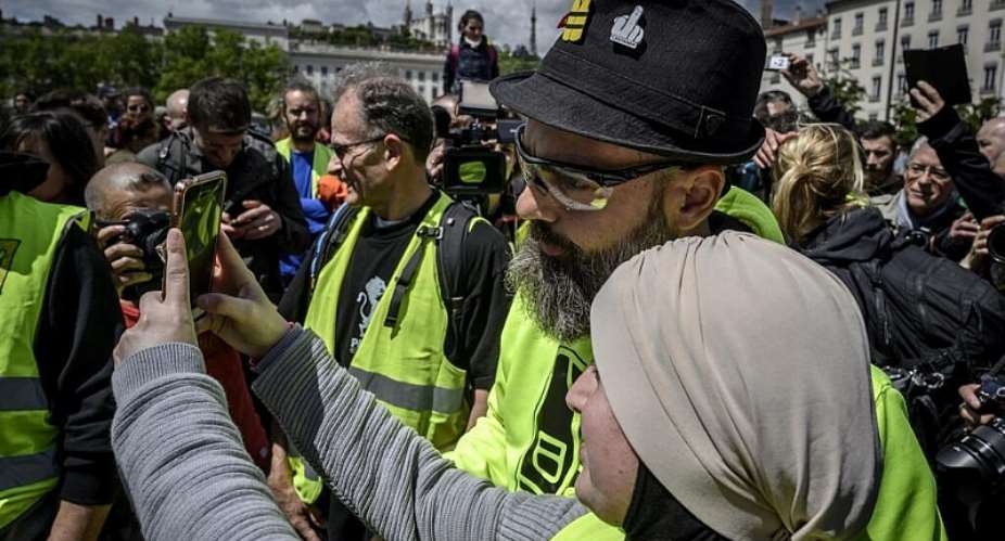 This file photo shows one of the Yellow Vest movements leading figures Jerome Rodrigues (C) during an anti-government demonstration called by the Yellow Vest movement, on May 11, 2019, at the Bellecourt square in Lyon, central-eastern France. -  Jean-Philippe Ksiazek, AFP