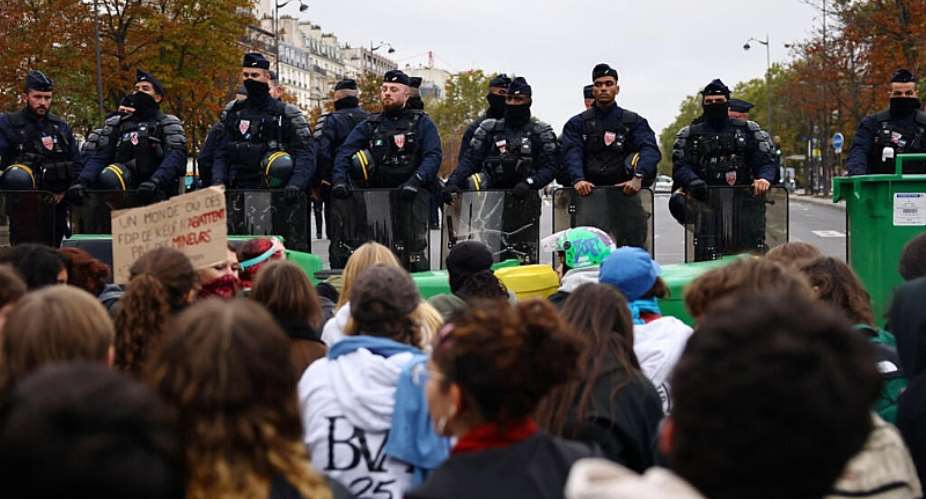 French high school students face CRS riot police during a sit-in to block a street near the Lyce Helene-Boucher high school in Paris, 16 October. -  Sarah Meyssonnier / Reuters
