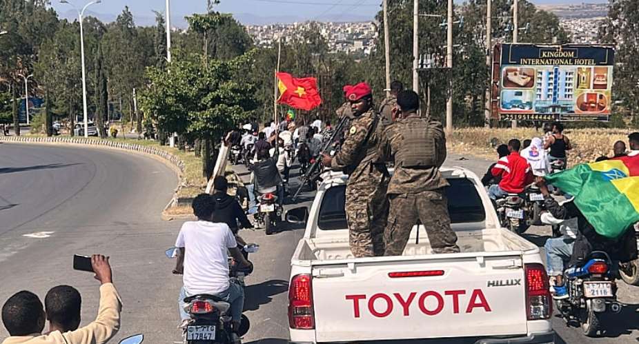 In this photo taken with a smartphone, soldiers participate in a procession welcoming former Tigray leader Getachew Reda in Mekelle, Ethiopia, October 11, 2026. -  Filmon Equar Hailu, AP