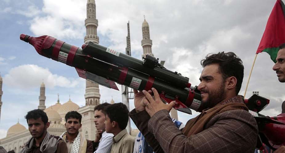 A Houthi supporter holds a mock missile during a demonstration in support of Palestinians, in Sanaa, Yemen, 5 April 2024. Houthi rebels are believed to have expanded their weapons-making capacities significantly in recent years. -  AP - Osamah Abdulrahman