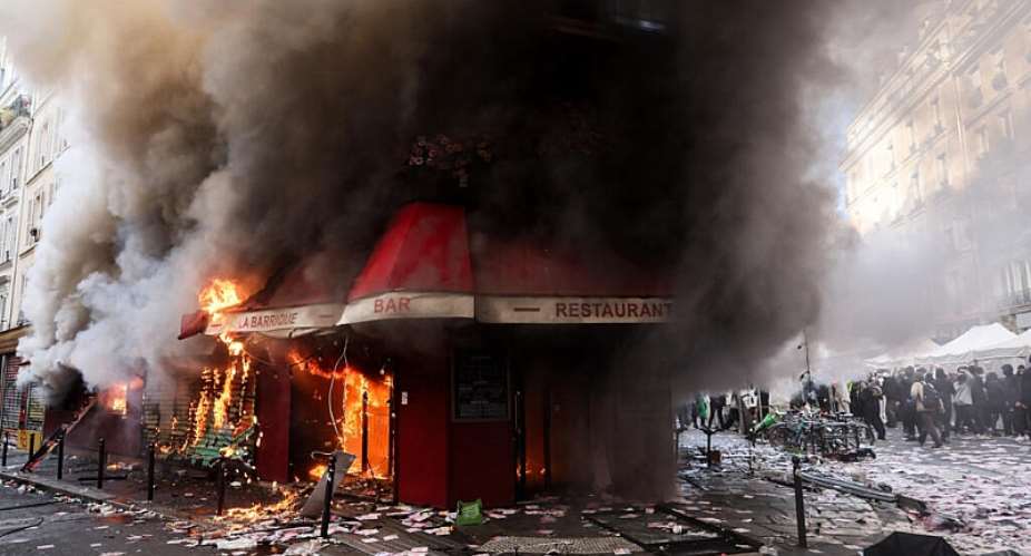 Masked youths clashed with police and fires were set in several cities, including Paris. -  Kiran Ridley, AFP