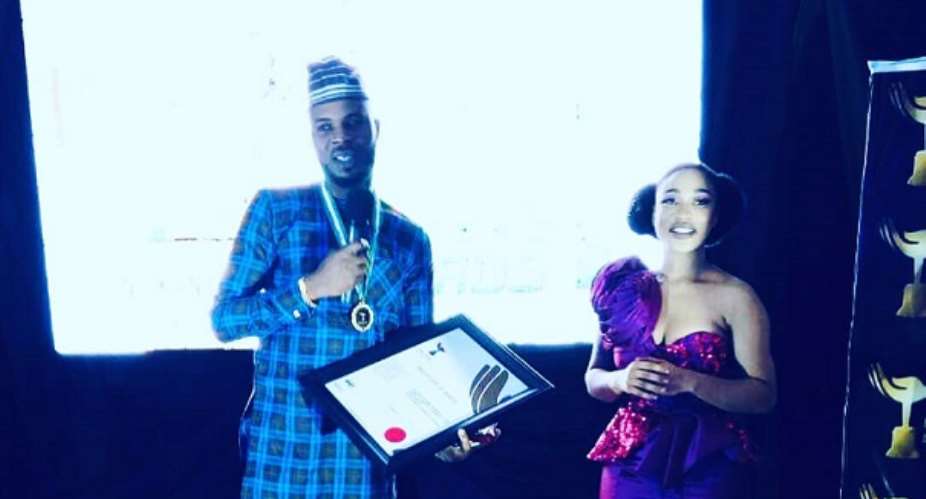 Tonto Dikeh Present Award To Popular Abuja Estate Guru Otunba Olakunle