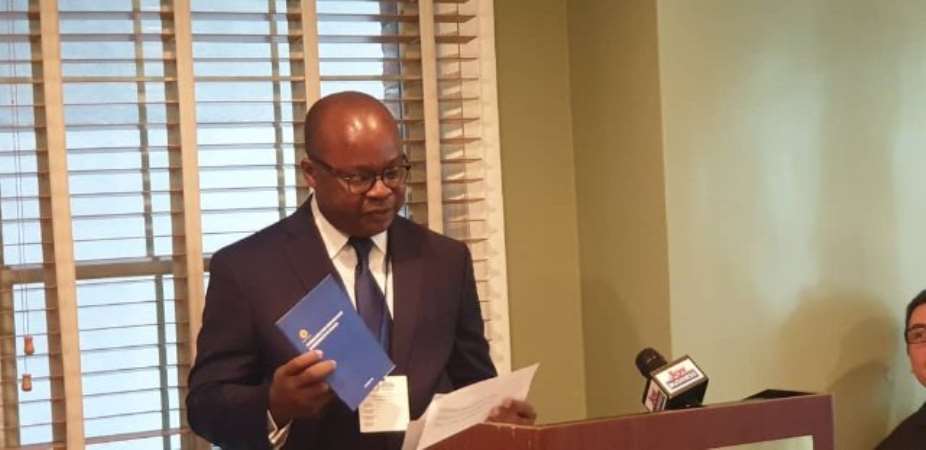 Governor of the Bank of Ghana, Dr Ernest Addison launching the guidelines on the sidelines of the IMFWorld Bank Annual Meeting in Washington DC