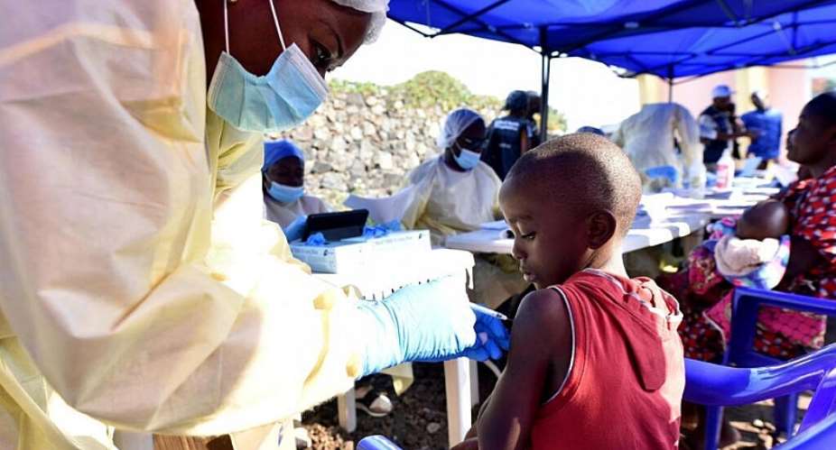 A healthcare worker administers a vaccine to a child in the city of Goma on 17 July 2019, during a previous Ebola outbreak in the Democratic Republic of Congo. -  REUTERS/Olivia Acland