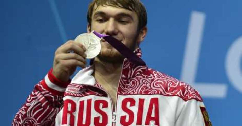 International Olympic Committee: IOC strips Russian weightlifter of London silver