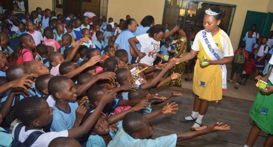 8 year old Beauty Queen Zikora Little  Miss Health donates Educational Materials, Sues for healthy environment