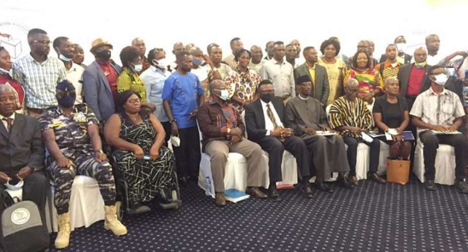 Security personnel, Chairman of the National Peace Council, Prof. Emmanuel Asante, and officials of CODEO in a group photograph after the opening ceremony.