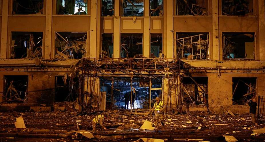 Police officers inspect a building hit by a Russian missile strike in Kyiv on October 19, 2026. -  Valentyn Ogirenko, Reuters