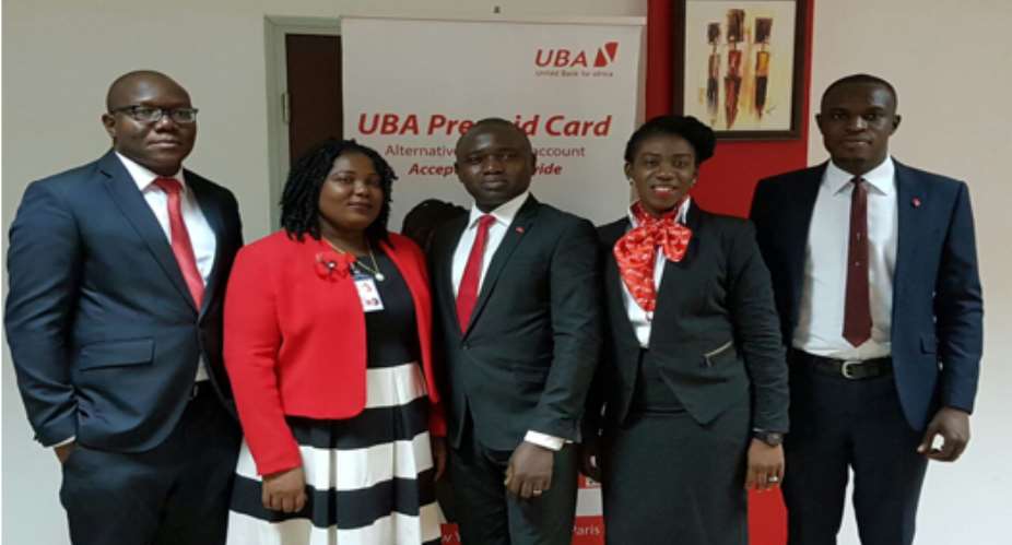 Richard Ahiagble left, Head of Corporate Communications-Airtel Ghana, Theresa Adade 2nd from left, Head of Operations, Airtel Money with Johnson Olakunmi middle, Head, Digital Banking Sales and his team from UBA.