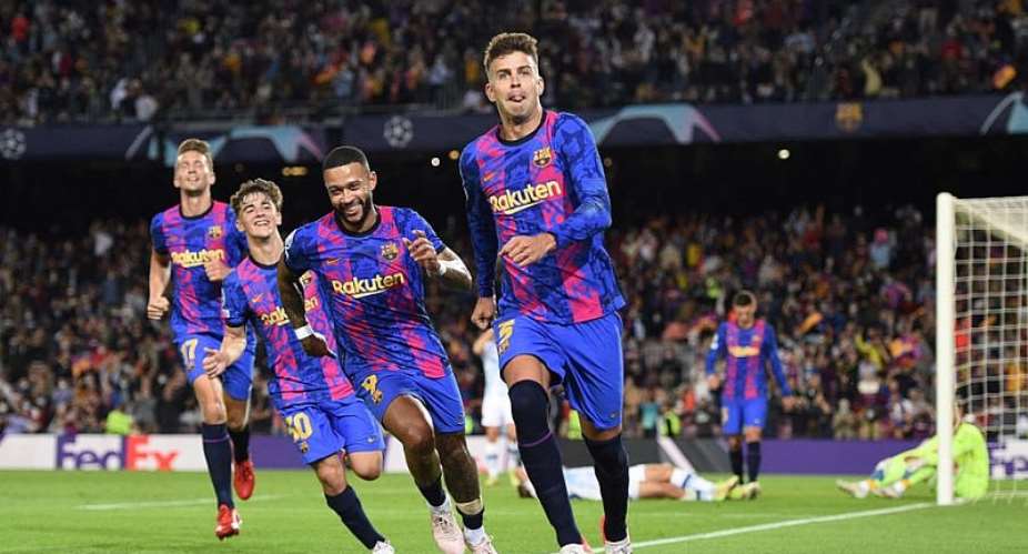 Pique keeps Barcelona hopes alive in Champions League