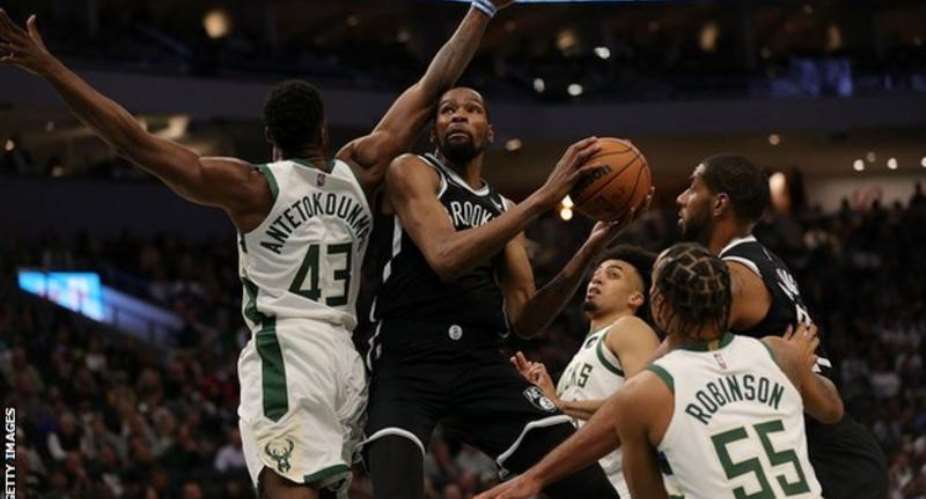 Reigning champions Milwaukee Bucks started their title defence with victory over Brooklyn Nets