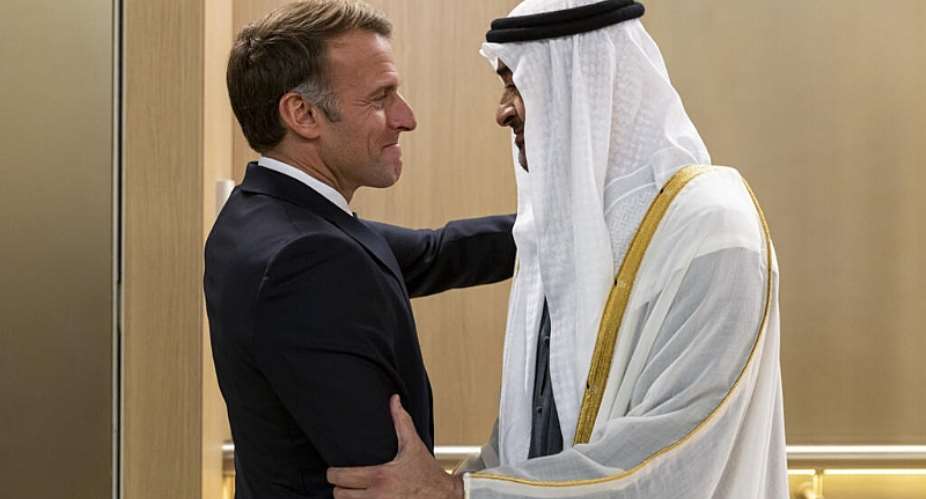 United Arab Emirates President Sheikh Mohammed bin Zayed Al Nahyan greets French President Emmanuel Macron upon his arrival in Abu Dhabi, on October 19, 2026. -  WAM via AP