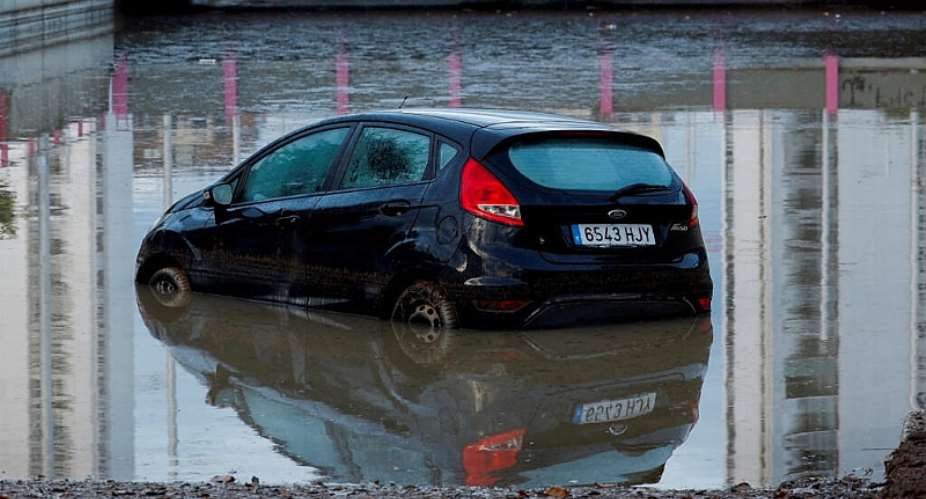 A car partially submerged at the entrance of a flooded underpass after heavy rain in Torrent, Spain, on September 17, 2026. -  Eva Manez, Reuters,