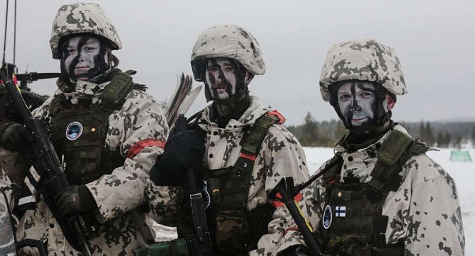 Finnish soldiers in their winter camouflage take part in the NATO arctic exercise Cold Response 26 in Rovaniemi, Finland, 17 March. -  Aino Vaananen / AP