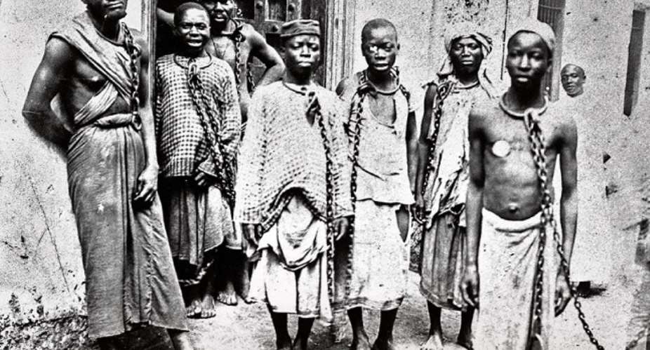 The enemies within, right behind the slaves is an African slave master in a white gown.