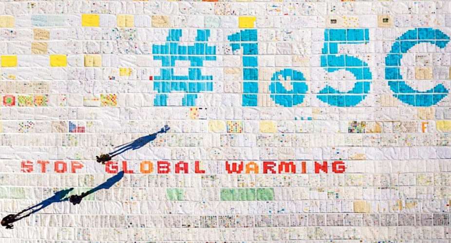 A giant postcard calling for global warming to be limited to 1.5C is displayed on Switzerland’s Aletsch glacier in November 2018. -  Valentin Flauraud/Keystone via AP
