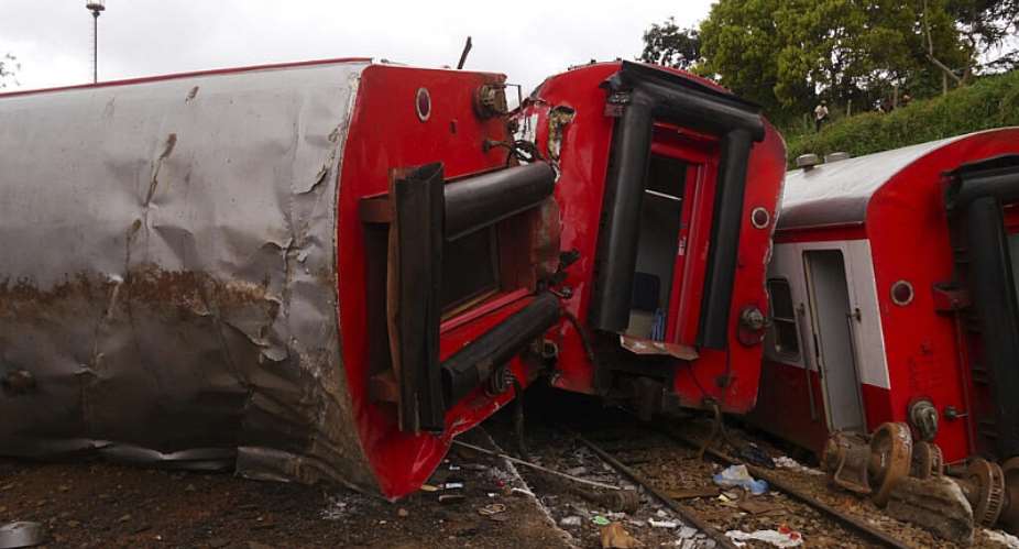 The overturned carriages of the train that derailed at Eseka, around 100 kilometres from Yaound in Cameroon on 21 October 2016. - AP - Joel Kouam