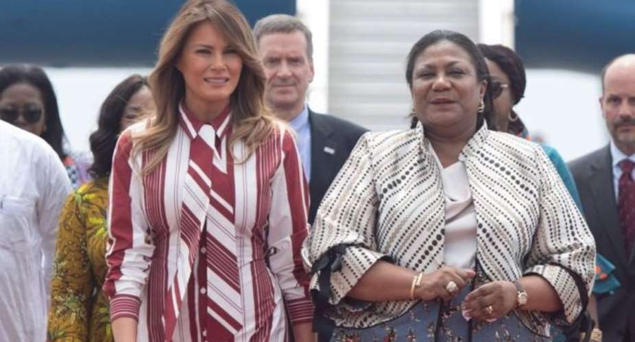 Melania Trump (left) with Rebecca Akufo-Addo at the airport