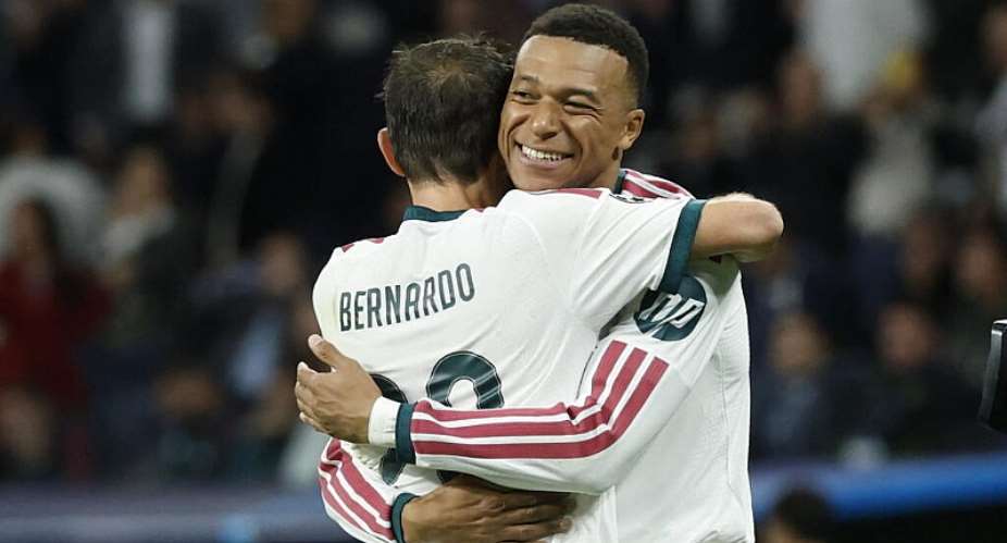 Real Madrids French forward Kylian Mbappe celebrates scoring his teams third goal during their UEFA Champions, October 21, 2026. -  AFP