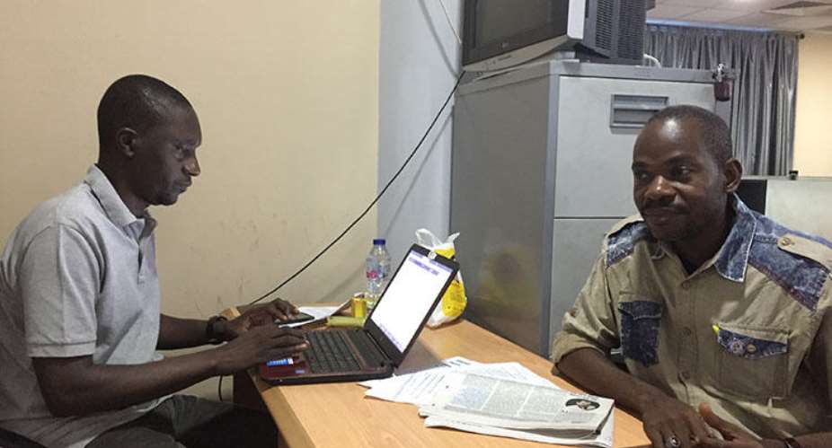 Hamza Idris left, an editor with the Daily Trust newspaper, sits with colleague Hussaini Garba Mohammed in their office in the Nigerian capital, Abuja, in February 2019. The office was raided in January by the military, who seized 24 computers. CPJJonathan Rozen