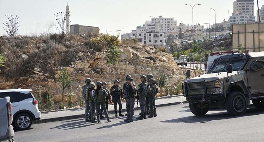 Israeli soldiers gather at the scene of a shooting attack at a junction near Hebron in the occupied West Bank on October 23, 2026. -  Mahmoud Illean, AP
