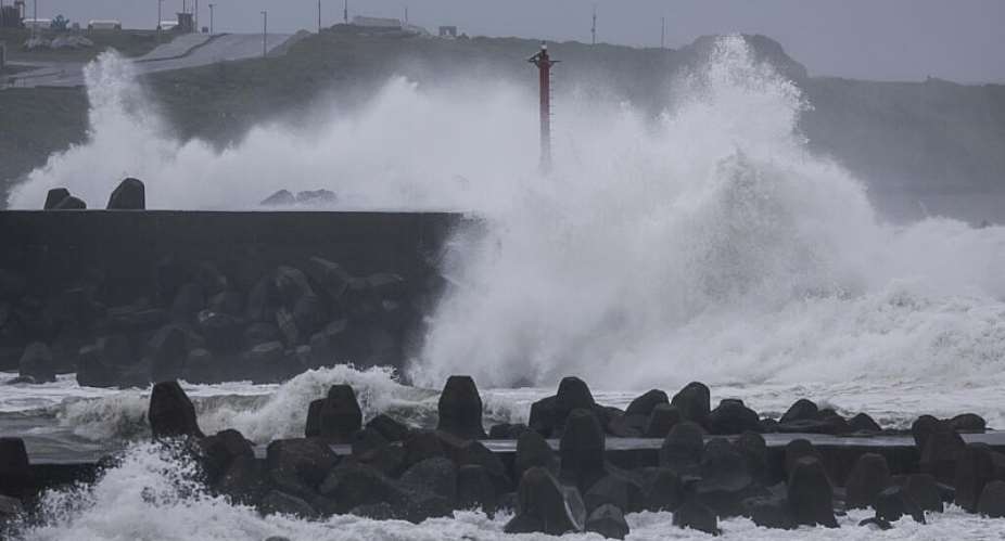 Waves crash against concrete wave breakers along the coast as Typhoon Champi approaches Taiwan, in Keelung on October 23, 2026. -  I-Hwa Cheng, AFP