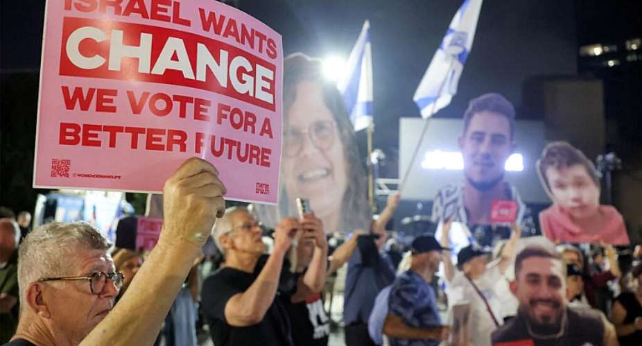 Protesters gather with signs depicting victims during an anti-government demonstration demanding the formation of a state commission of enquiry into Hamas 2023 October attacks at the Hostages Square in Tel Aviv on October 24, 2026, ahead of Israels legislative election. -  Jack Guez, AFP