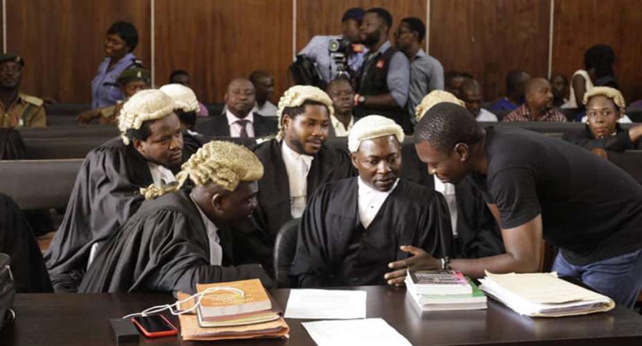 CrossRiverWatch journalist Agba Jalingo right is seen in a federal high court in Calabar, Nigeria. The court recently granted anonymity to witnesses expected to testify against Jalingo. Oto-Obongo ClementCrossRiverWatch