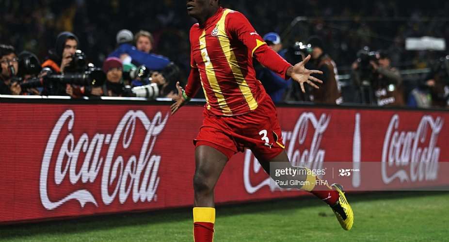 RUSTENBURG, SOUTH AFRICA - JUNE 26: Asamoah Gyan of Ghana celebrates scoring his side's second goal during the 2010 FIFA World Cup South Africa Round of Sixteen match between USA and Ghana at Royal Bafokeng Stadium on June 26, 2010 in Rustenburg, South Africa. Photo by Paul Gilham - FIFAFIFA via Getty Images