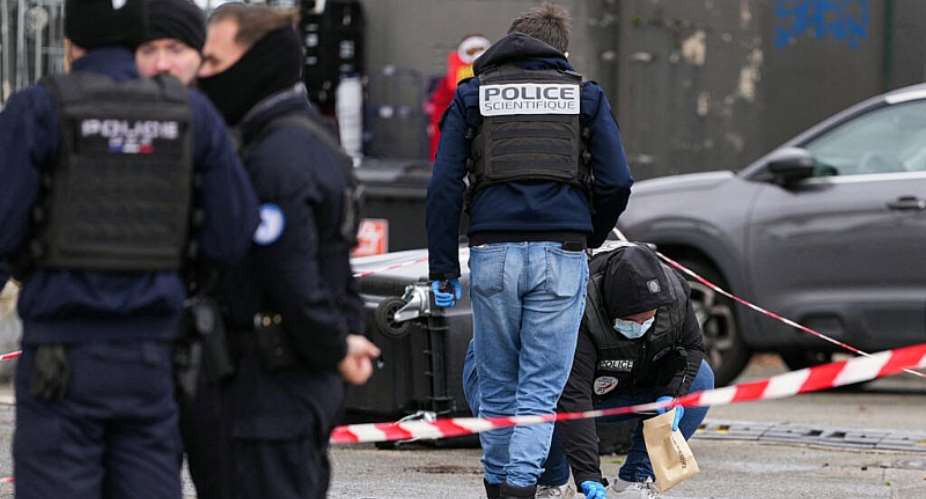 Forensics intervene on a site of a petrol station where a man opened fire from his car, killing one person and injuring four others in Trappes, near Paris, on October 23, 2026. -  Dimitar Dilkoff, AFP