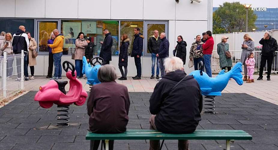 People wait in line outside a polling station before the start of the voting in a parliamentary election in Belgrad on October 25, 2026. -  Petr David Josek, AP