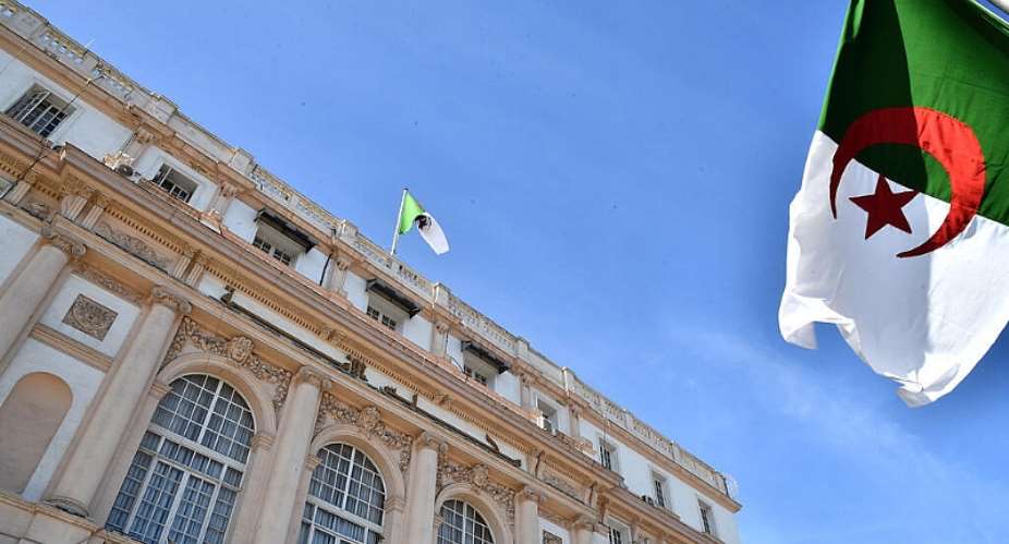 Algerian flags outside the parliament building in Algeria on October 25, 2026. -  Fateh Guidoum, AP