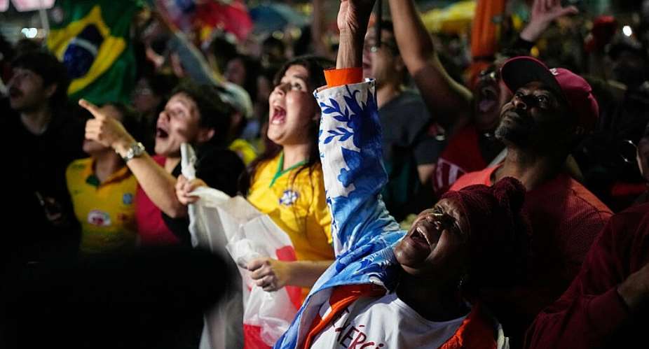 Supporters of President Luiz Inacio Lula da Silva, who is seeking reelection, cheer as presidential runoff results are announced in Sao Paulo, Sunday, Oct. 25, 2026. -  Natacha Pisarenko. AP