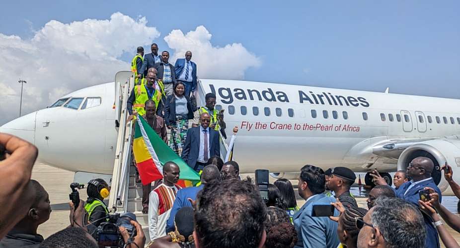 Passengers disembarking from the inaugural Uganda Airlines flight to Accra