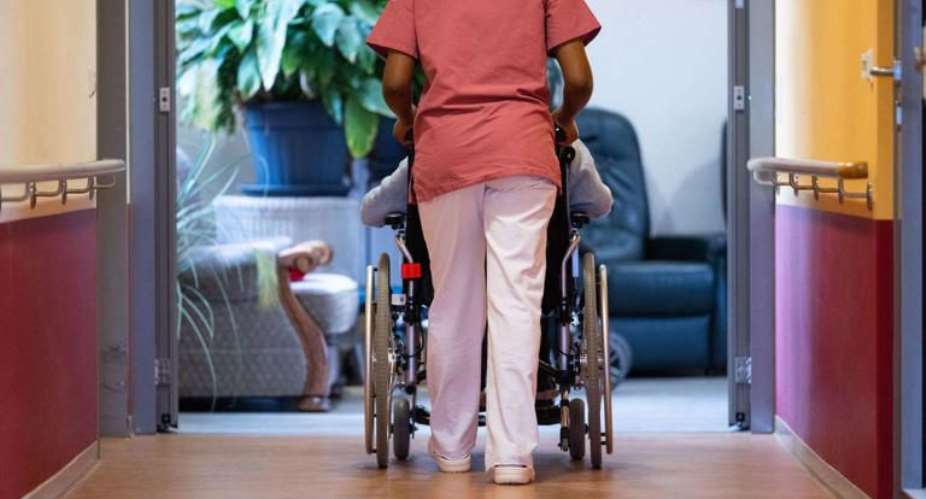 A carer is alleged to have defrauded an elderly woman of her savings