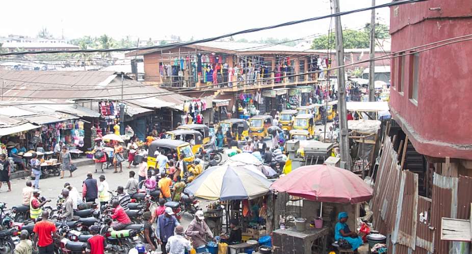 A tightly packed and busy urban slum in Ajegunle, Lagos, Nigeria. - Source: shutterstock