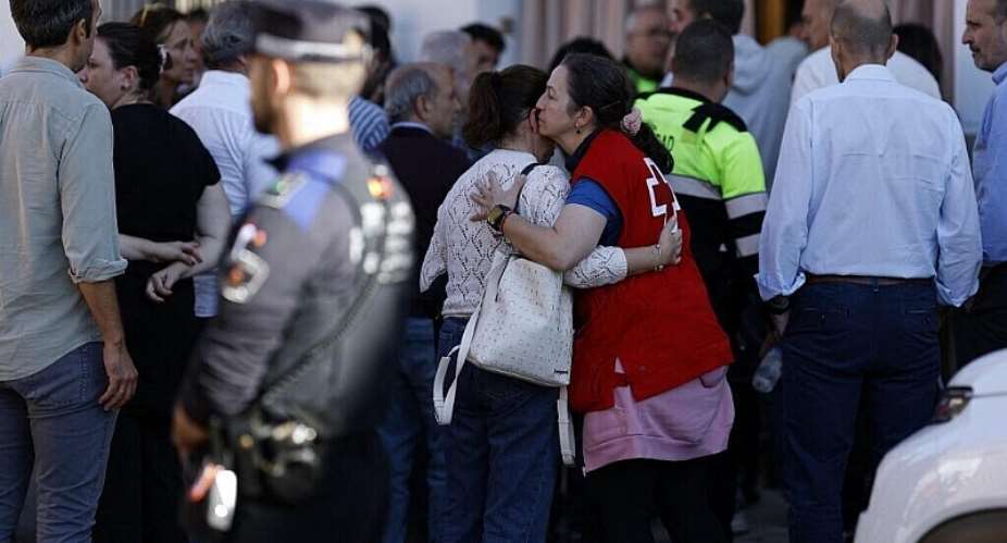 A Red Cross volunteer conforts a woman outside a support center for relatives of missing victims in Urda, following the train crash between a high-speed Renfe AVE train and an Iryo train around 150 km south of Madrid between Urda and Los Yebenes in the province of Toledo, on October 28, 2026. -  Oscar Del Pozo, AFP