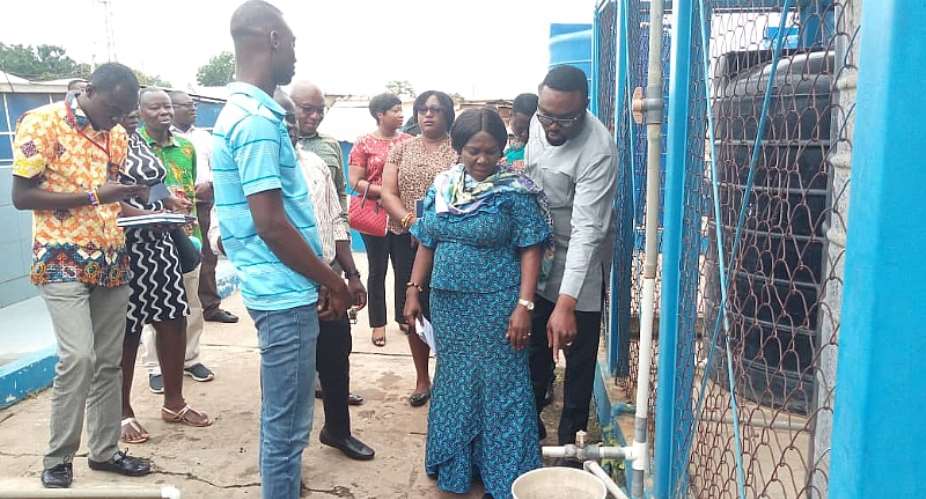 Minister for Sanitation and Water Resources, Hon. Cecilia Dapaah inspecting the sanitary conditions of a water station at Amasaman during the tour