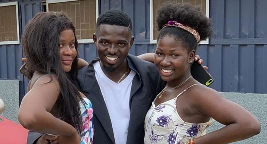 FILE — Comedian Waris middle on set with two actresses in Ghana