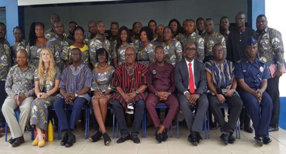 ACP George Tweneboah and other senior police officers in a group photograph with participants