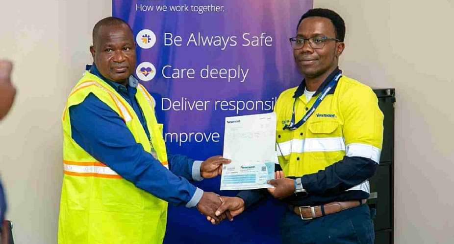 Mr. Charles Bissue, the General Manager of Newmont Ahafo North Mine (right) presenting the cheque to Prof. Julius Ceaser Puoza, the Pro-VC of STU