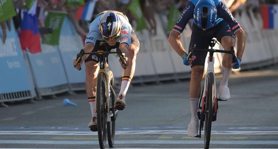 Remco Evenepoel (left) crosses the finish line to win ahead of Giulio Ciccone. -  Jure Makovec, AFP