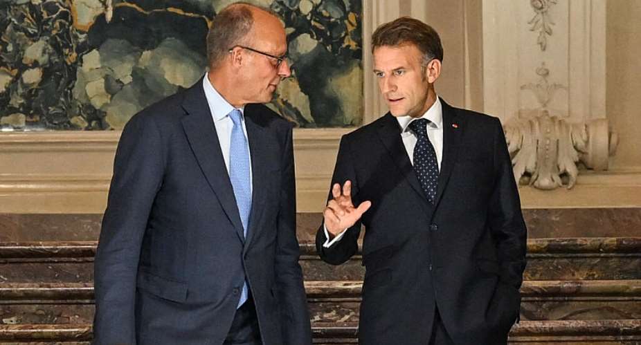 French President Emmanuel Macron and German Chancellor Friedrich Merz arrive for a joint press conference at Augustusburg castle in Bruehl, Germany, on July 17, 2026. -  Ina Fassbender, AFP