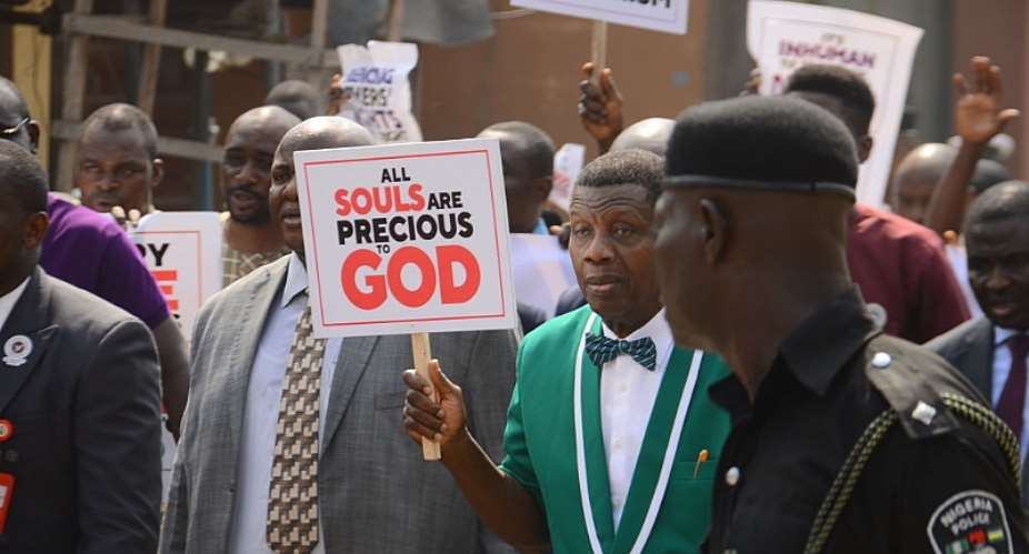 The General Overseer of the Redeemed Christian Church of God, Enoch Adeboye, holding a placard, leading a protest in Lagos. - Source: Olukayode JaiyeolaNurPhotoGetty